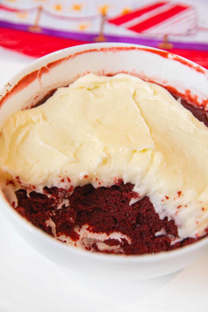 Microwave Red Velvet Cake with bites take out in cereal bowl
