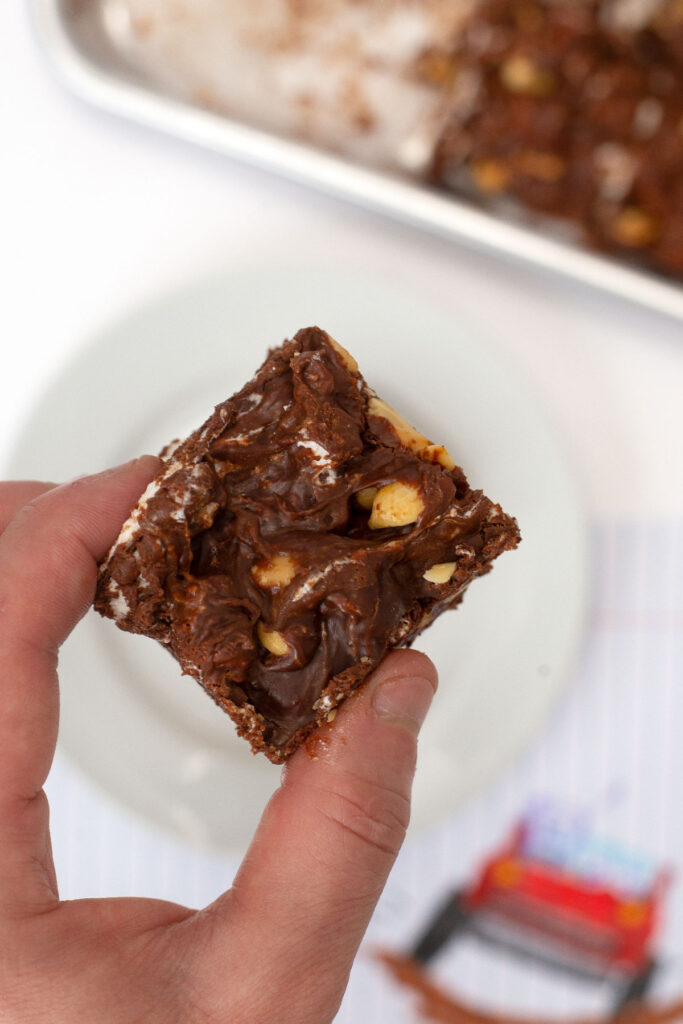 Microwave Rocky Road Candy square held by fingers