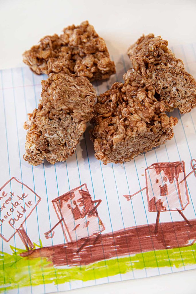 Microwave Nutella Rice Krispies Treats cut into squares on notebook paper