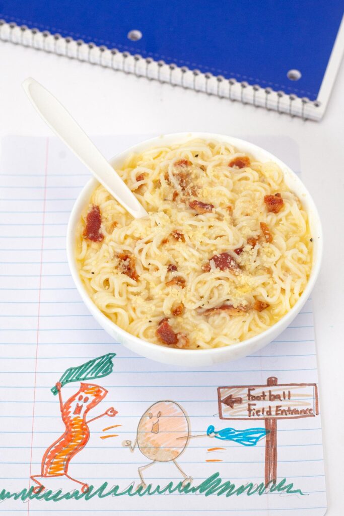 Microwave Bacon Ramen Carbonara in bowl with fork