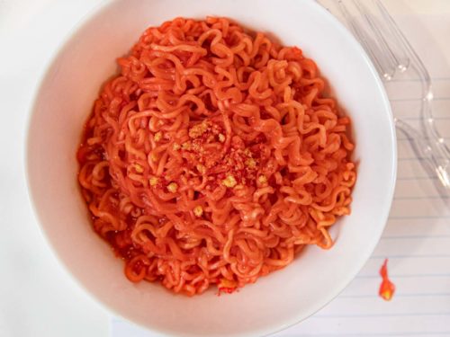 Microwave Flamin' Hot Cheetos Ramen in bowl