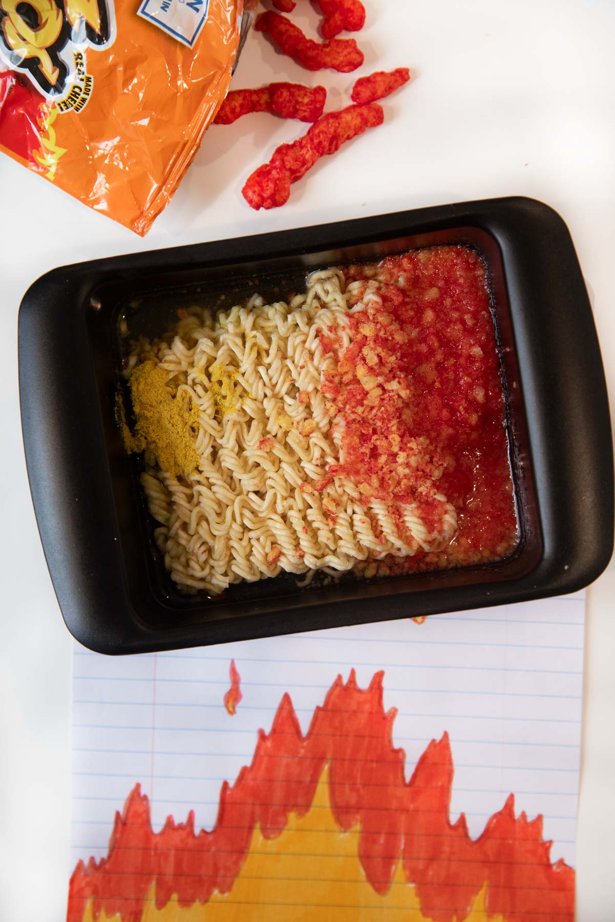 Microwave Flamin' Hot Cheetos Ramen ingredients in ramen cooker