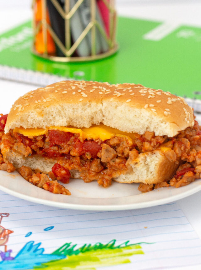 Microwave Sloppy Joes sandwich on plate with bite removed