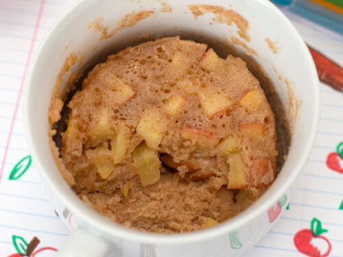 Microwave Apple Cinnamon Muffin in bowl with scoop removed