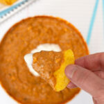 Microwave Cheesy Taco Dip scoop on tortilla chip