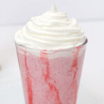 Strawberry Frappuccino in cup topped with whipped cream